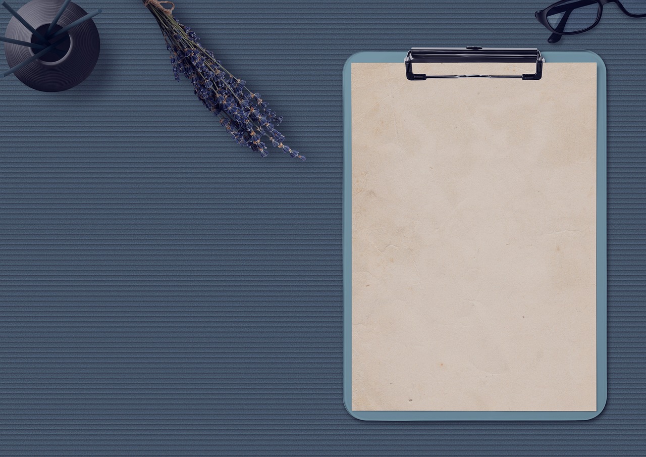 table, notepad, glasses